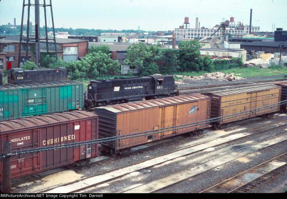 PC 6812 doing yard drills, while 6018 on deadline watches.